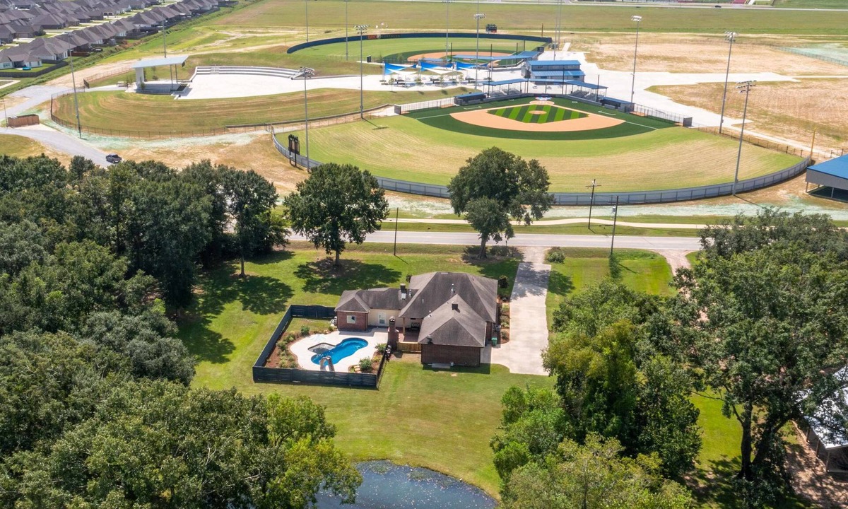 Youngsville House | Gameday Getaway Pool Pond King Sports Complex Office Premier Host