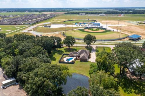 Youngsville House | Gameday Getaway - Pool - King Bed - Sports Complex