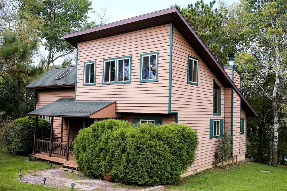 Tomah House | Lakefront Cabin Rental with a Paddle Boat near Wisconsin Dells, Wisconsin