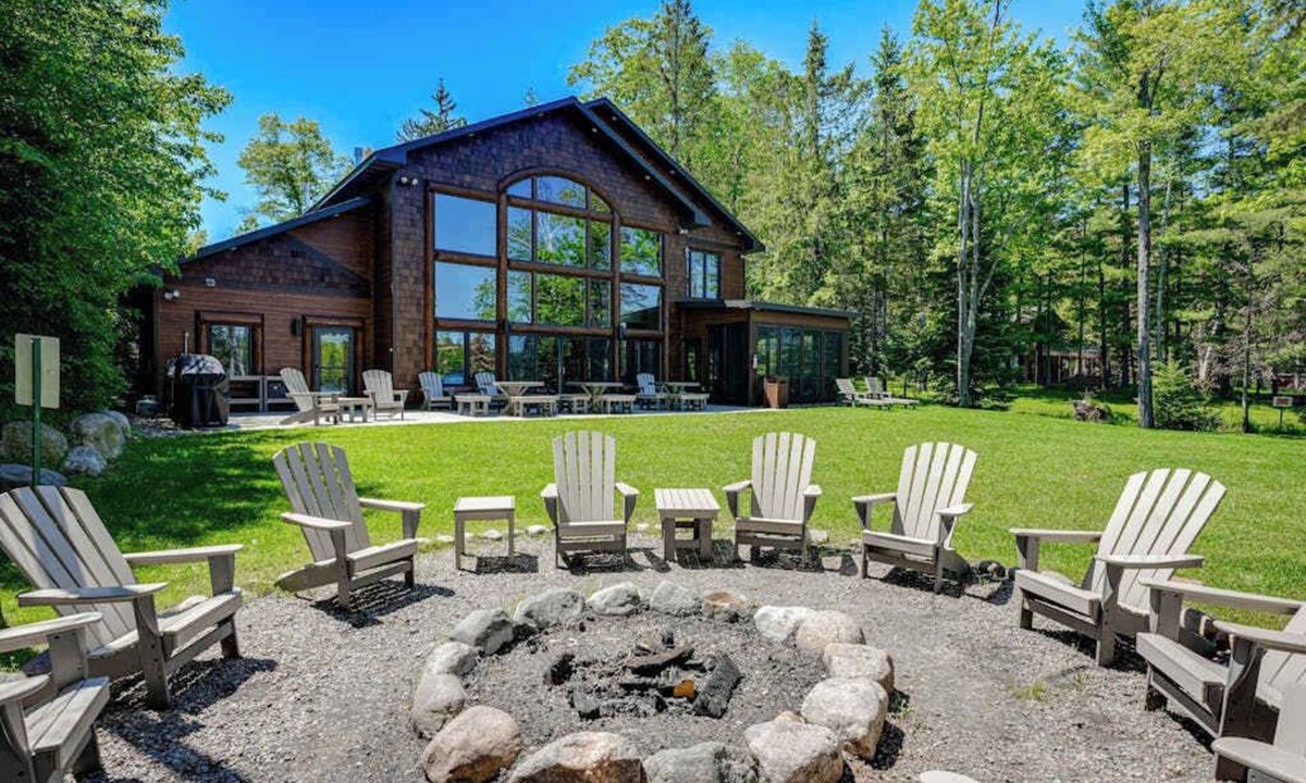 Eagle River House | Luxury lakefront home with high-speed WiFi, dock, private beach, & theater room