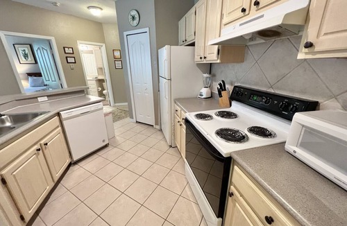 West Kissimmee Condo | 19-202 Gated Resort, Private balcony, heated pool, minutes from Disney! gym