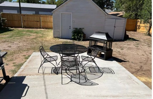 Woodward House | Blue house on 5th! Arcade room, fire pit, privacy fenced yard, and more!