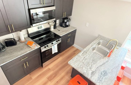 Osage Beach Cabin | Cozy 740 sq ft A-frame cabin at North Shore Resort with lake views, 1 bedroom + loft (sleeps 6), full kitchen, island seating, and a private deck—perfect for relaxing getaways at Lake of the Ozarks.