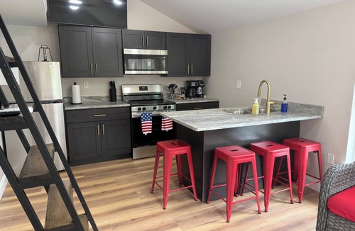 Osage Beach Cabin | Cozy 800 sq ft A-frame cabin at North Shore Resort with lake views, 1 bedroom + loft (sleeps 6), full kitchen, island seating, and a private deck—perfect for relaxing getaways at Lake of the Ozarks.