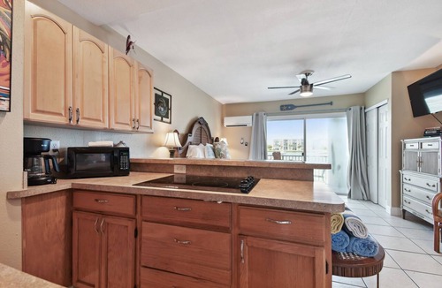 Bay Esplanade Apartment | Enchanted Inn Suite #6: Waterfront, Pool, Fishing Dock, Boat Docks & Tiki Bar!