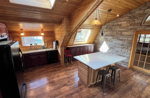 Birchwood Cabin | Family friendly home for quiet retreats. 6 bed lodge on quiet lake near trails