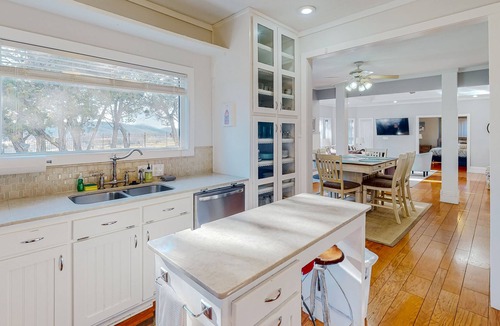 Holiday Island House | Gorgeous water view home with a fireplace, outdoor space & central AC