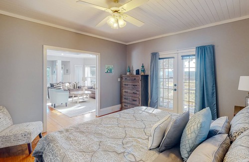 Holiday Island House | Gorgeous water view home with a fireplace, outdoor space & central AC
