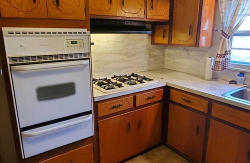 Malvern House | House with a full kitchen big backyard with trees