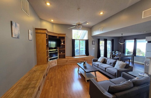 Marion House | Lake Front home Sleeps 10 Overlooking deck for perfect lake views & a coffee bar