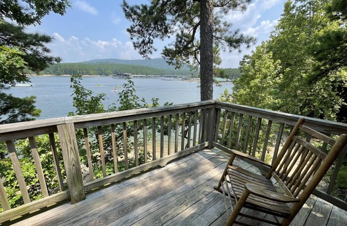 Mount Ida Cottage | Lake view two bedroom, two bath loft, log-sided cottage with private hot tub overlooking Lake Ouachita. by RedAwning