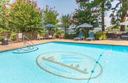 Mount Ida Cottage | Lake view two bedroom, two bath loft, log-sided cottage with private hot tub overlooking Lake Ouachita. by RedAwning