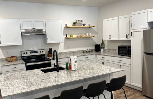 Garfield House | LAKEFRONT Bliss FLAT to water: Spacious home with Game Room, Sleeps 15 Guests!