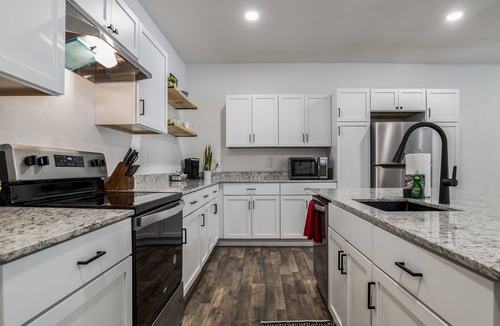 Garfield House | LAKEFRONT Bliss FLAT to water: Spacious home with Game Room, Sleeps 15 Guests!