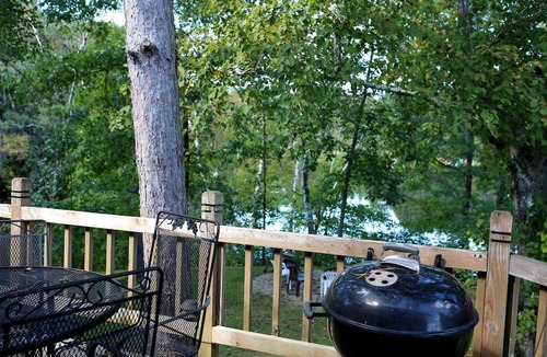 Tomah House | Lakefront Cabin Rental with a Paddle Boat near Wisconsin Dells, Wisconsin