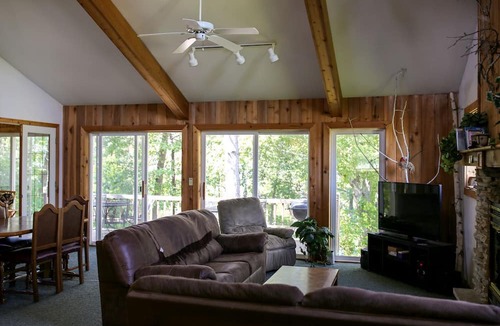 Tomah House | Lakefront Cabin Rental with a Paddle Boat near Wisconsin Dells, Wisconsin