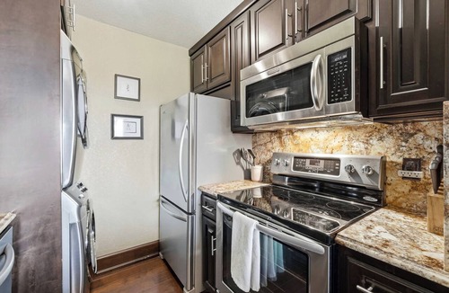 Prairie Creek Condo | Lakeview Home in Rogers with Firepit & Balcony