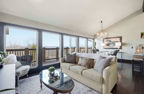 Prairie Creek Condo | Lakeview Home in Rogers with Firepit & Balcony