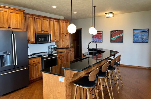 Arnolds Park Condo | Luxurious Lakefront BB Corner Condo. Panoramic lake views & 6 waterpark passes.