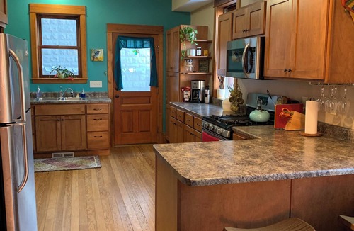 Dubuque House | Neighborhood Townhome with Botanical Vibes