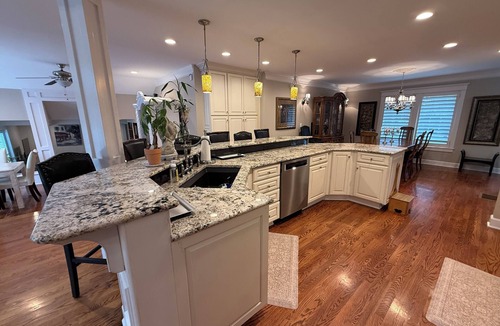 Gladstone House | Ranch style 4-bedroom home on a short acre in Kansas City North (12 miles from Arrowhead Stadium) with an open floor plan and approx. 4000 sq. ft. of living area. A gourmet kitchen, and a large private deck w/BBQ. Ideal Major international sporting event getaway!