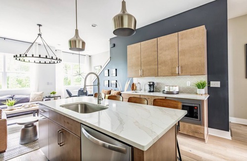 Katie Hill Neighborhood House | Skyline Serenity – Rooftop Patio – Ping Pong