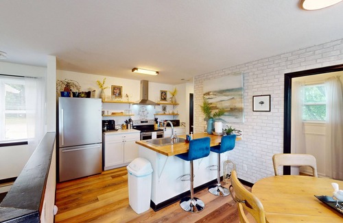 Piney House | Stylish duplex with lakefront views, modern design, and spacious interiors
