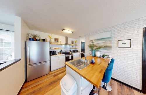 Piney House | Stylish duplex with lakefront views, modern design, and spacious interiors