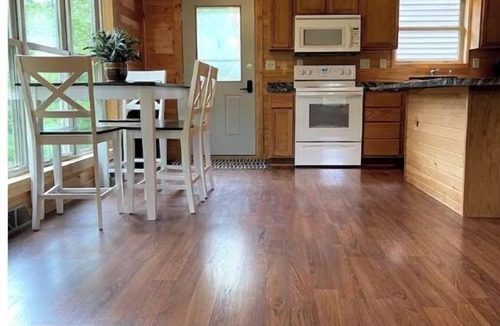 Westby House | Timber Coulee Creek in backyard, king size bed, grill on deck, large garage.