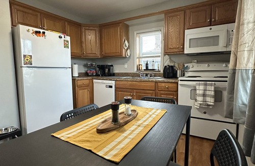 Overland Park House | Welcoming family feel enjoy a full kitchen, washer and dryer, and a pet friendly