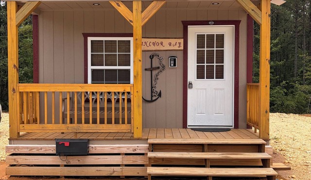 BRAND NEW! 1 bedroom cabin with two beds and a large couch. Near pickwick lake