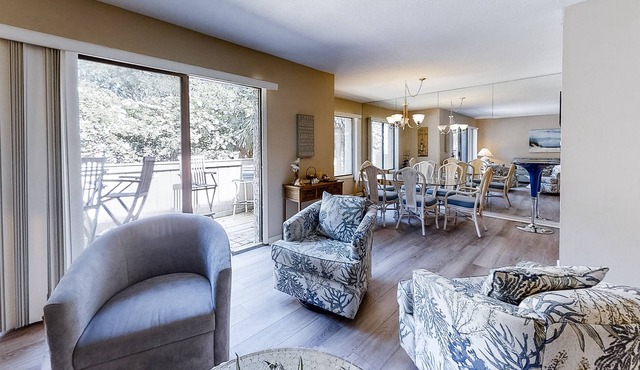 Coastal getaway with balcony, full kitchen, & washer/dryer -close to the beach
