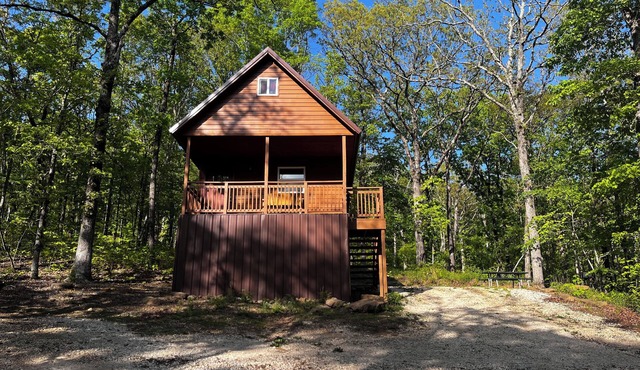 Cozy tiny cabin nestled in a little woodland village – playground, pond and more