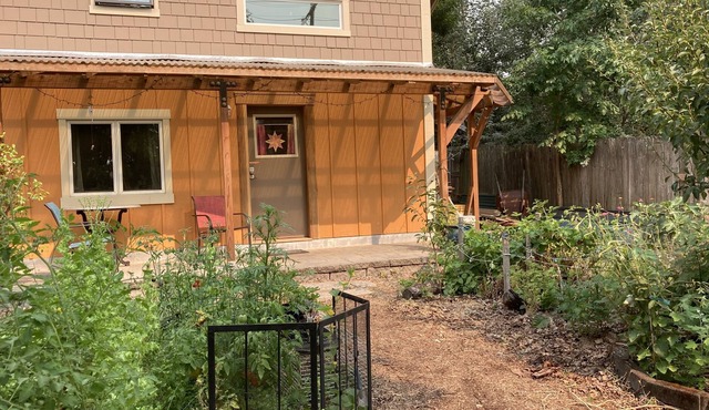 Custom Built Tiny House in an organic backyard garden in Eugene