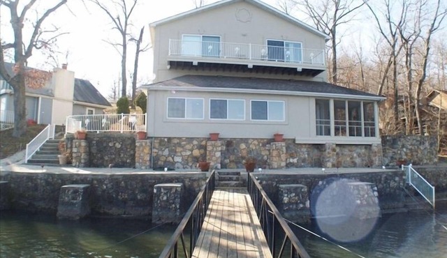 Palm Breeze is ready for Summer. 6 Bedrooms/4.5 Baths Lake Front!