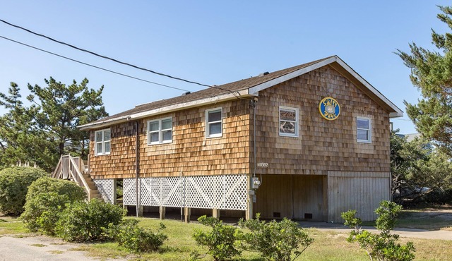 Semi-oceanfront dog-friendly home with private hot tub, decks & shared pool