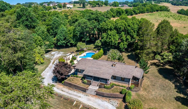 Serene cabin with pool, hot tub, game room, fireplace, & free attraction tickets
