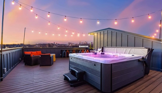 Summer hot tubs, rooftop decks, skyline views near Broadway