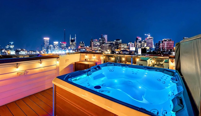 Summer rooftop hot tub, game room, skyline views near Broadway