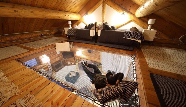 This beautiful log cottage has large windows that let in lots of light