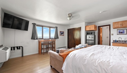 1 King Bed, 1 Queen Sleeper Sofa River View, Upper Level